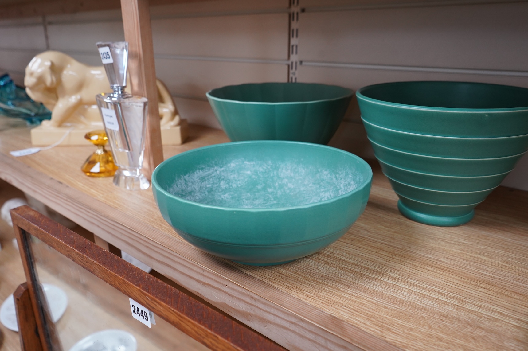 Keith Murray for Wedgwood, three green glazed bowls to include a ribbed example, largest 24cm in diameter